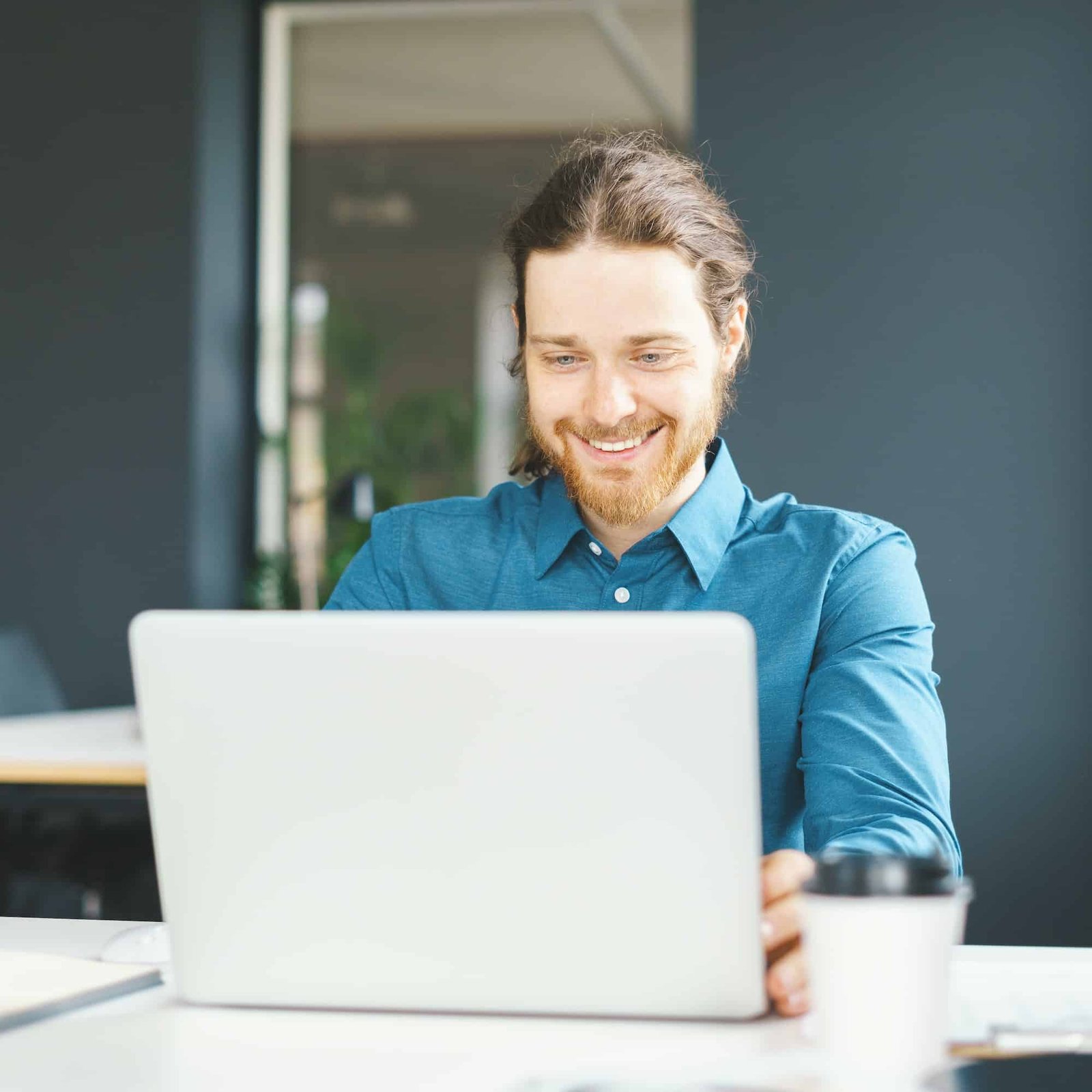 happy-young-male-office-employee-working-on-laptop-computer.jpg happy-young-male-office-employee-working-on-laptop-computer.jpg